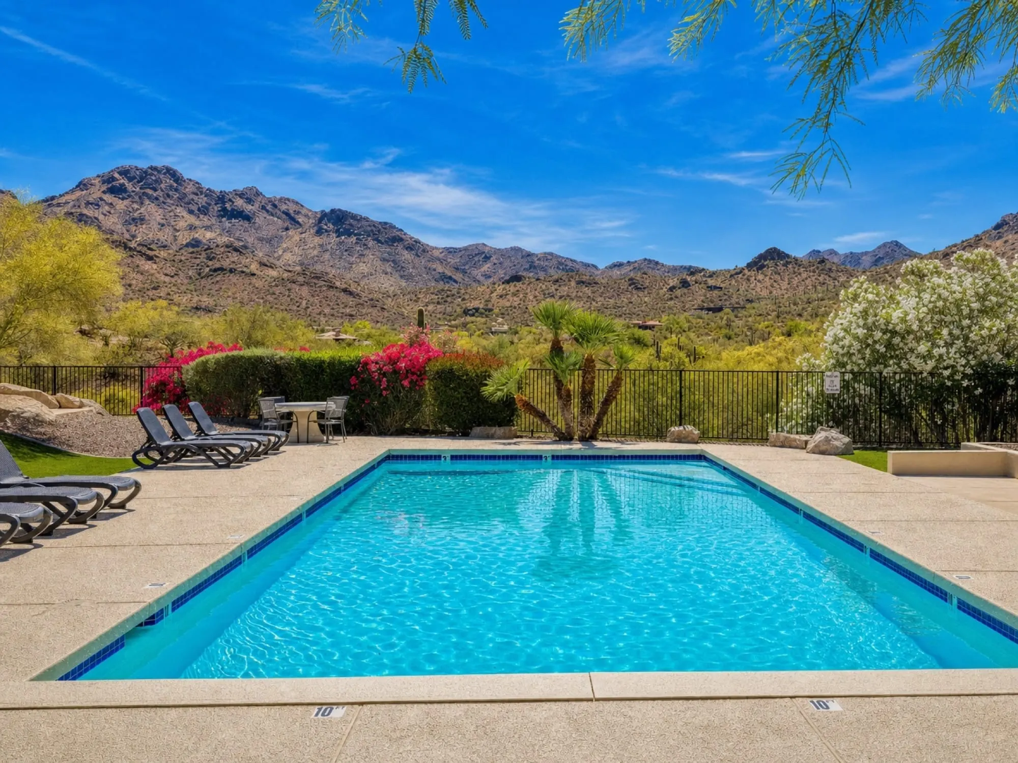 Pool with mountain views at a Veranza home